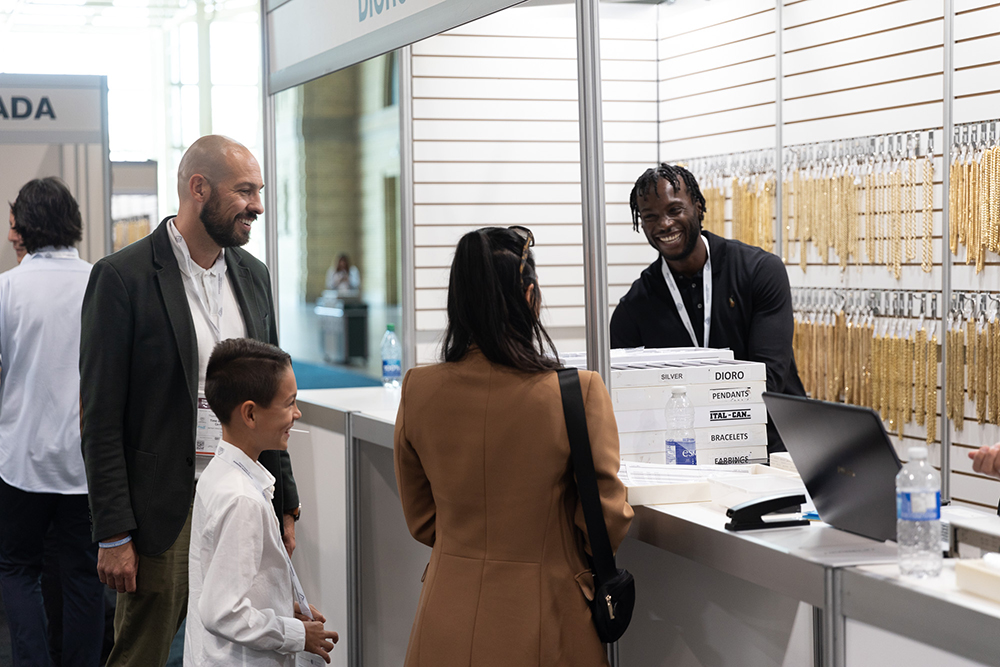 A family of jewellery retailers at a booth counter on the Time and Shine floor