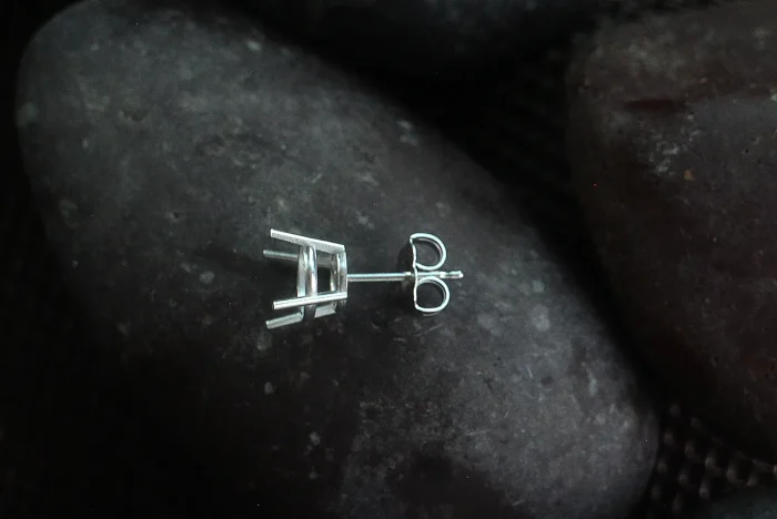 Gold findings by weight: 14kt stud posts and butterfly backs on grey stone